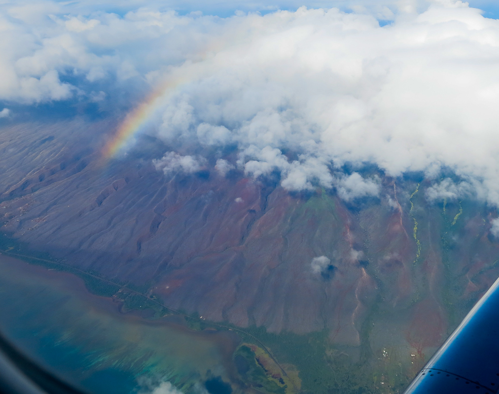 Flug mit Regenbogen